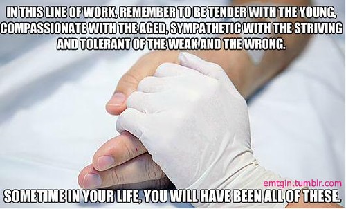 Nurse holding patients hand